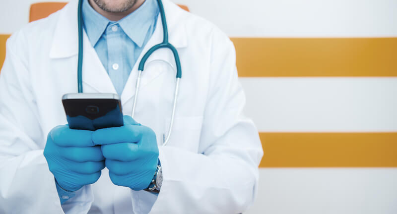 physician-doctor-communicating-through-cell-phone-2025-03-15-13-30-50-utc (1)